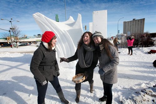 Random Acts of JUNO Manitoba artists like  singer/songwriters Jocelyn Gould (red hat, left) Shannon Kristjanson (centre) and Rayannah Kroeker with the trio band Collage-¾-trois, spread the spirit of music to warm Winnipeger's in non-traditional locations throughout the city like on the Festival du Voyageur snow sculpture on the  corner of St. Mary's and Marion Street Wednesday doing Random Act of JUNO  event,  during the weeks leading up to the JUNO Awards. Feb 12,, 2014 Ruth Bonneville / Winnipeg Free Press