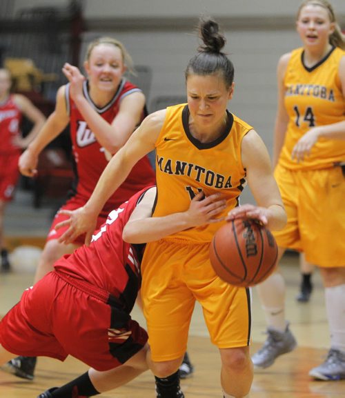 The University of Manitoba Bisons win against the U of W Wesman Women basketball team at the Investors Group Athletic Centre. 23rd annual Duckworth Challenge. Bisons #11 Christina Fischer tries to get by Wesman Megan Noonan. BORIS MINKEVICH/WINNIPEG FREE PRESS  Feb. 13/14