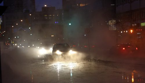 Another day another water main break, on Friday morning water rises on Ellice Ave. at Vaughan St. closing both lanes to traffic. Wayne Glowacki / Winnipeg Free Press Feb. 14   2014