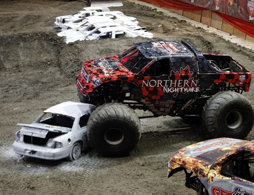 Stdup , Monster Truck  Driver Cam McQueen crushes car  for kids who attned the  anti bullying event  - Monster Jam and Kids Help Phone team up Stop Bullying  Champaign  in Wpg at the MTS Centre Monster Jam  driver Cam McQueen  and Wpg activist Michael Redhead Champagne  founder of Aboriginal Youth Opportunities  gave a talk  and roll playing  demonstration on how to deal with cyber bullying for local youth . The kids also signed a pledge board against bullying .Maple Leaf Monster Jam runs FEb 15,16 at MTS Centre ,    FEB. 14 2014 / KEN GIGLIOTTI / WINNIPEG FREE PRESS