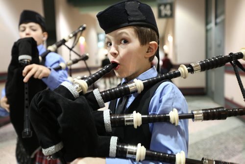 Eleven year old Gavin Zimmer practices his technique while waiting to perform playing his bagpipe in front of a judge at the Western Canada's largest indoor piping and drumming competition Saturday morning at the Convention Centre.  The free event runs all day (until 5pm).  Boy in the background is 12 year old Ezra Felstrom-Stenka.  Standup photo.  Feb 15,, 2014 Ruth Bonneville / Winnipeg Free Press