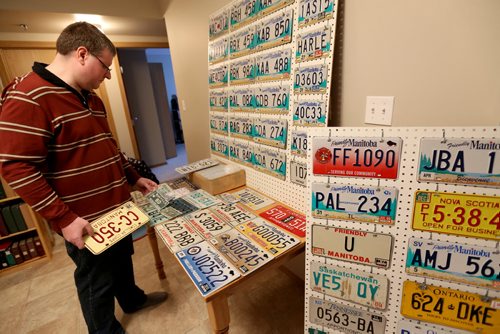 Manny Jacob, a member of the ALPCA, an international association of license plate collectors, and part of his collection, Friday, February 14, 2014. (TREVOR HAGAN/WINNIPEG FREE PRESS) - for 49.8 intersection dave sanderson piece.