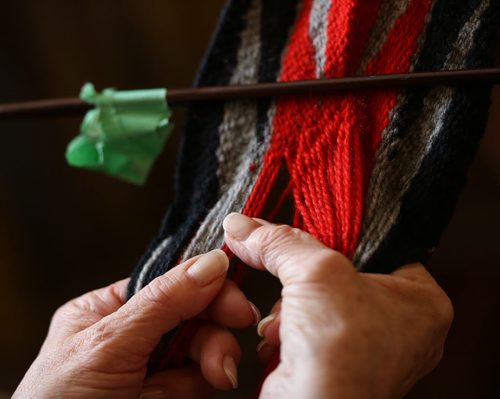 CLaudette Carriere demonstrating finger weaving at The Festival du Voyageur, Sunday, February 16, 2014. (TREVOR HAGAN/WINNIPEG FREE PRESS) - for conne textile workshop article