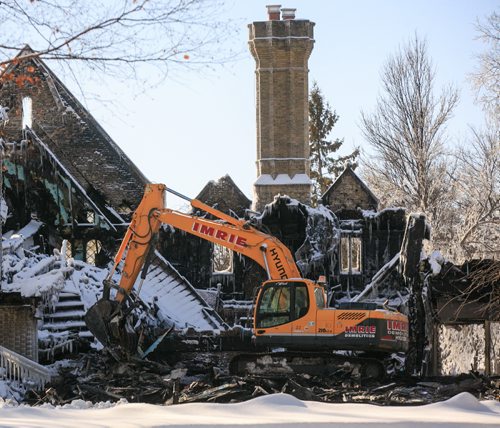 Aftermath of the fire at 1021 Wellington Crescent from the back. The structure was partially knocked to the ground on Monday to aid investigators.   140217 - Monday, {month name} 17, 2014 - (Melissa Tait / Winnipeg Free Press)