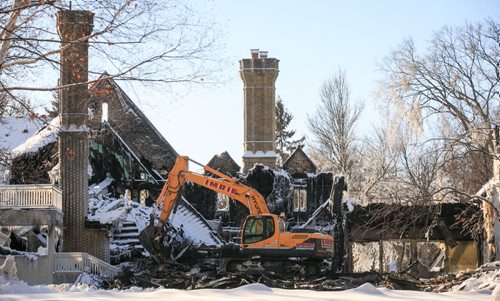 Aftermath of the fire at 1021 Wellington Crescent from the back. The structure was partially knocked to the ground on Monday to aid investigators.   140217 - Monday, {month name} 17, 2014 - (Melissa Tait / Winnipeg Free Press)