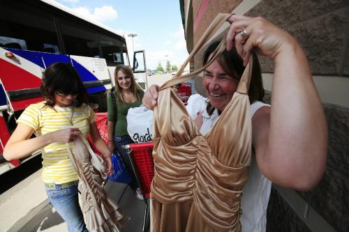 John Woods / Winnipeg Free Press / June 16/07- 070616  - Margaret Post (R) and her daughter Melissa (L) show off their grad dress bargains as friend Stefanie Stobbe looks on outsideTarget in Grand Forks June 16/07.  The high Canadian dollar seems to be encouraging shoppers to head south for some bargains.
