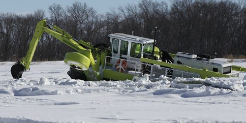 One of three Amphibex ice breaking machines out on the Red River north of Selkirk by Netley Creek Tuesday morning part of the 2014 ice jam mitigation program.  Bruce Owen story. Wayne Glowacki / Winnipeg Free Press Feb. 18   2014