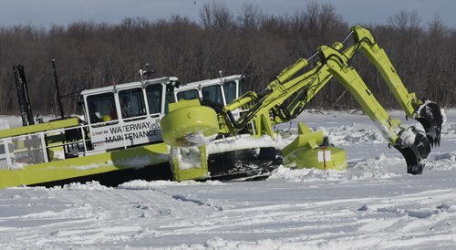 Two of the three Amphibex ice breaking machines out on the Red River north of Selkirk by Netley Creek Tuesday morning part of the 2014 ice jam mitigation program.  Bruce Owen story. Wayne Glowacki / Winnipeg Free Press Feb. 18   2014