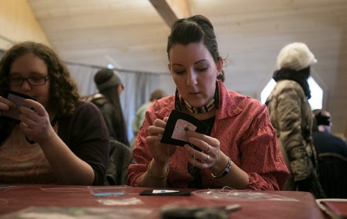 Nathalie Rivard works on a Metis beading design during a workshop at Festival Du Voyageur. (story for 49.8 by Connie) 140217 - Monday, {month name} 17, 2014 - (Melissa Tait / Winnipeg Free Press)