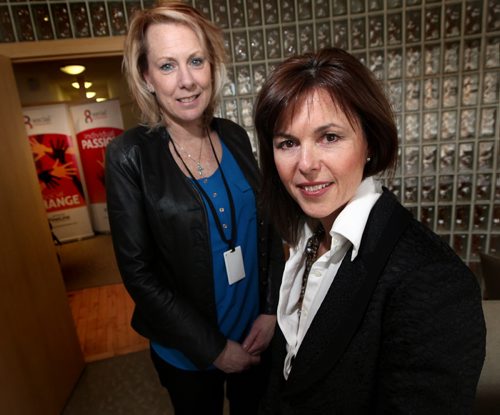 Polly Craik (Pres. and CEO) (right) and Jocelyn Chipman (CO/SO) (left) of Fine Line pose with banners from "Social Ambassador. See Martin Cash story. February 19, 2014 - (Phil Hossack / Winnipeg Free Press)