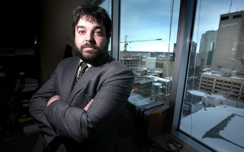 Karl Gowenlock poses in his downtown office Wednesday. See story. February 19, 2014 - (Phil Hossack / Winnipeg Free Press)