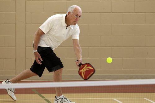 Larry Ladyman plays Pickleball, a sport that is a little bit badminton, a little bit tennis, at the Sturgeon Heights Community Centre Wednesday morning. 140219 - Wednesday, February 19, 2014 -  (MIKE DEAL / WINNIPEG FREE PRESS)