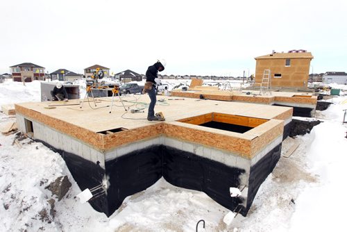 New home construction in Sage Creek development in South East Winnipeg. BORIS MINKEVICH / WINNIPEG FREE PRESS  Feb. 19/14