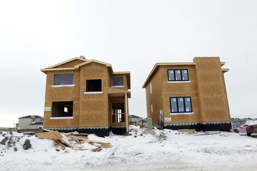 New home construction in Sage Creek development in South East Winnipeg. BORIS MINKEVICH / WINNIPEG FREE PRESS  Feb. 19/14
