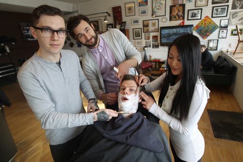 Hunter & Gunn barber shop at 567 Broadway-L to R Dru Barrow, rear Mason Melle, Kim Nguyen and owner Jeremy Regan-    See  Geoff Kirybyson story- Feb 19, 2014   (JOE BRYKSA / WINNIPEG FREE PRESS)