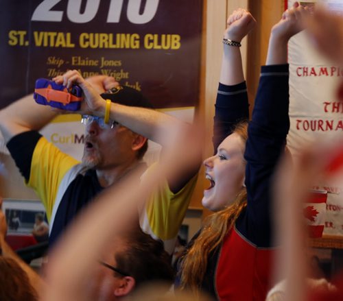 in pic Hannah Beaudrey and celebrates  with  St. Vital Curling fans when Jennifer Jones won Gold at the Sochi Olympics  with Yes, St. Vital CC is opening the doors at 6:30 am (game is at7:30 am) for a viewing party . The club is filling up with members and fans including Kerry Kohut  with her cow bell leading the cheers . We hope to have a large crowd of our members  out to watch the gold-medal game featuring Jennifer Jones At Sochi Olympic Gold medal Game FEB. 20 2014 / KEN GIGLIOTTI / WINNIPEG FREE PRESS