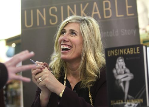 Silken Laumann, a three-time Olympic medalist,  shares her smile with her fans as she signs copies of her new book, Unsinkable: A Memoir at McNally Robinson Booksellers at Grant Park Shopping Centre Thursday afternoon.  Feb 20,, 2014 Ruth Bonneville / Winnipeg Free Press