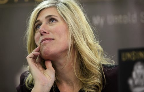 Silken Laumann, a three-time Olympic medalist,  listens intently to one of her fans own traumatic story as she signs copies of her new book, Unsinkable: A Memoir at McNally Robinson Booksellers at Grant Park Shopping Centre Thursday afternoon.  Feb 20,, 2014 Ruth Bonneville / Winnipeg Free Press