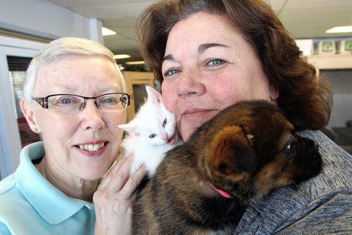 Carla Martinelli-Irvine (right), founder and director of the Winnipeg Pet Rescue Shelter with long-time volunteer Susan Murray (left) and a couple little cuddly guys ready for adoption. 140220 - February 20, 2014 MIKE DEAL / WINNIPEG FREE PRESS