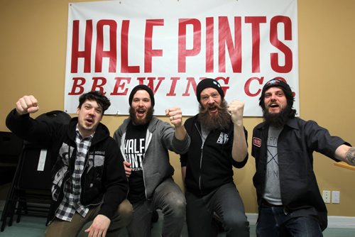 Josh Bedry, Brandon Bertram, Matt Nelson, Jan Field, Staff at Half Pints Brewing Co. pose for a photo in the room where the Olympic hockey party will take place. They're shutting down tomorrow, and the staff is going to congregate upstairs in the boardroom and do some "quality control," order pizza and watch Olympic hockey. BORIS MINKEVICH / WINNIPEG FREE PRESS  Feb. 20/14