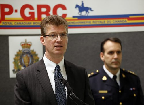 For the first time in North America  The Hells  Angels Motorcycle Club  has been listed as a criminal organization eliminating  days of court time normally used to establish this  designation , LtoR ¬Assistant Commissioner Kevin Brosseau, commanding officer, RCMP "D" Division Justice Minister Andrew Swan ,(left not in photo)  ¬Insp. Rick Guyader, Organized Crime Division, Winnipeg Police Service announce WHERE: Atrium, RCMP "D" Division, 1091 Portage Ave.TOPIC: Significant announcement regarding criminal organizations  ,.. Bruce Owen story  with video . FEB. 20 2014 / KEN GIGLIOTTI / WINNIPEG FREE PRESS