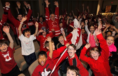 Kids and staff of Linden Christian school cheer on Team Canada as they play Team U.S.A in the mens hockey semifinals at the Olympics. BORIS MINKEVICH / WINNIPEG FREE PRESS  Feb. 21/14