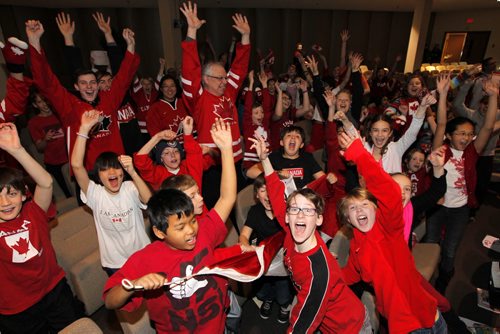 Kids and staff of Linden Christian school cheer on Team Canada as they play Team U.S.A in the mens hockey semifinals at the Olympics. BORIS MINKEVICH / WINNIPEG FREE PRESS  Feb. 21/14
