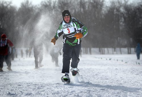 Andrew  Dyck leaves his opponents in the dust as he races down the snow packed 100m snowshoe course in the field at ST. John's Ravenscourt while competing in the 34th Annual Kinsmen Winnipeg WInter Games Saturday Afternoon.  Standup photo Feb 22,, 2014 Ruth Bonneville / Winnipeg Free Press