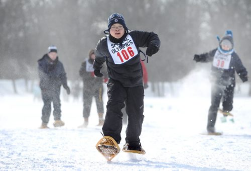 Jericho Cochico leaves his opponents in the dust as he races down the snow packed 100m snowshoe course in the field at ST. John's Ravenscourt while competing in the 34th Annual Kinsmen Winnipeg WInter Games Saturday Afternoon.  Standup photo Feb 22,, 2014 Ruth Bonneville / Winnipeg Free Press