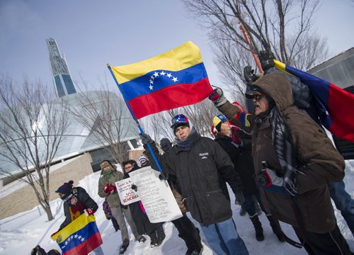 140222 Winnipeg - DAVID LIPNOWSKI / WINNIPEG FREE PRESS - February 22, 2014  A group braved the cold Saturday afternoon to rally support for Venezuela in front of the Canadian Museum for Human Rights to raise awareness of alleged human rights violations in the country.