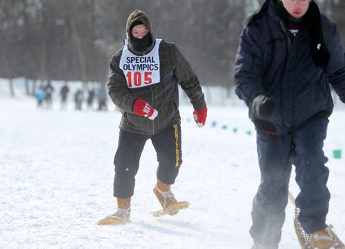 Action art  of David Cheyne as he makes his way over the finish line while  competing in Special Olympics  100m snowshoeing at 2014 Special Olympics Winter Games held at St. John's Ravesncourt Saturday.  See Prest story.  Training Basket.   Feb 22,, 2014 Ruth Bonneville / Winnipeg Free Press