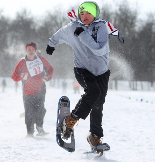 Gabriel Mayham leaves his opponents in the dust as he races down the snow packed 100m snowshoe course in the field at ST. John's Ravenscourt while competing in the 34th Annual Kinsmen Winnipeg WInter Games Saturday Afternoon.  Standup photo Feb 22,, 2014 Ruth Bonneville / Winnipeg Free Press