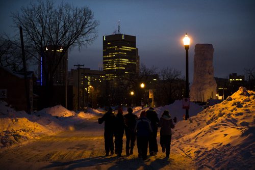 140222 Winnipeg - DAVID LIPNOWSKI / WINNIPEG FREE PRESS - February 22, 2014  Festival goers leave the park Saturday evening. The Festival du Voyageur was a popular place to be Saturday afternoon, with the 10 day festival wrapping up Sunday evening.