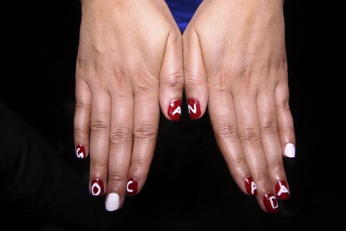A fan holds her nails painted with Go Canada at the Confusion Bar & Grill during the Olympic Men's Hockey Gold medal game between Canada (3) and Sweden (0) Sunday morning. 140223 - Sunday, February 23, 2014 -  (MIKE DEAL / WINNIPEG FREE PRESS)
