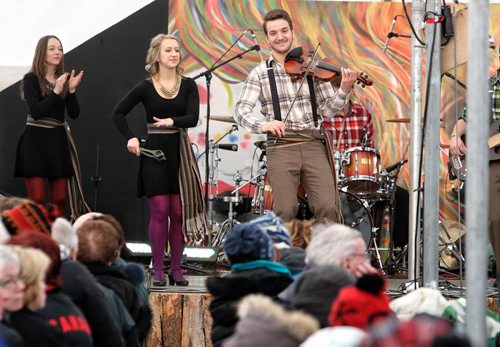 Despite the biting wind hundreds took in the entertainment on the last day of the Festival du Voyageur Sunday. Members of ¾áa Claque! perform, Nicolas Messener on the fiddle and St¾©phanie Touchette on the spoons. 140223 - February 23, 2014 MIKE DEAL / WINNIPEG FREE PRESS