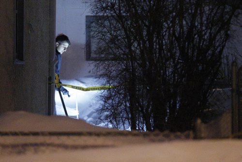 February 23, 2014 - 140223  -  Police investigate at 611 Harbison Ave. east in Winnipeg Sunday, February 23, 2014. There are reports that a male was found dead in the backyard. John Woods / Winnipeg Free Press