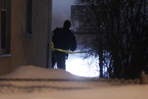 February 23, 2014 - 140223  -  Police investigate at 611 Harbison Ave. east in Winnipeg Sunday, February 23, 2014. There are reports that a male was found dead in the backyard. John Woods / Winnipeg Free Press