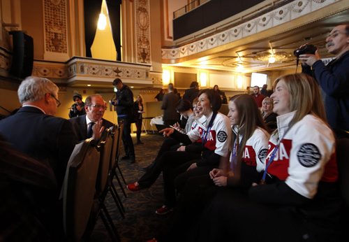 At right, members of Team Jones the Olympic gold medalists chat with Premier Greg Selinger and Mayor Sam Katz prior to the announcement of the JUNO Canadian's Music Awards Week details at the Metropolitan Entertainment Centre Tuesday morning. Wayne Glowacki / Winnipeg Free Press Feb. 25   2014