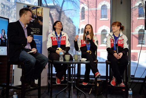 Jill Officer (second from left) laughs while fellow Olympian Kaitlyn Lawes (second from right) tells a story with Dawn McEwen (right) during an interview and Q&A with reporter Geoff Kirbyson at the Winnipeg Free Press News Cafe.   140225 February 25, 2014 Mike Deal / Winnipeg Free Press