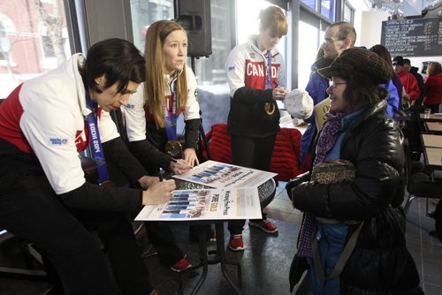 (l-r) Jill Officer, Kaitlyn Lawes and Dawn McEwen of the Canadian Women's Gold medal curling team at the Winnipeg Free Press News Cafe for a Q&A interview with reporter Geoff Kirbyson Tuesday afternoon. 140225 - Tuesday, February 25, 2014 -  (MIKE DEAL / WINNIPEG FREE PRESS)