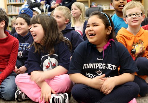 Abby Boidy (left pink) and Ciara Oliver laugh along with their fellow students from grade 1 to grade 3 at Princess Margaret School on Tuesday during a  visit by Jets Zach Bogosian and Mark Scheifele  as part of I love to read month. Standup photo Feb 25,, 2014 Ruth Bonneville / Winnipeg Free Press