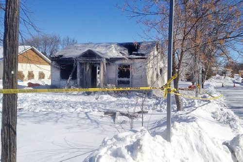 A woman is dead and a man is in hospital after a house fire in Boissevain early Tuesday morning, February 25 2014. Firefighters say it took four hours to extinguish the blaze. (Ian Hitchen/Brandon Sun)
