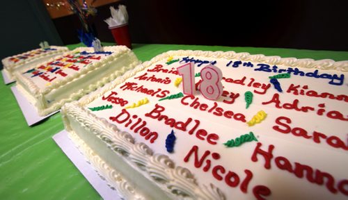 Brithday cakes line a table at a local CFS Age of Majority Celebration. Its a rite of passage for kids in care who are turning 18 and the first time weve been invited to the emotional event that reveals another side of the child welfare system  from the perspective of the kids who lived through it. See Carol Sanders story. February 25, 2014 - (Phil Hossack / Winipeg Free Press)