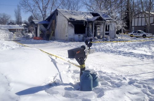 A woman is dead and a man is in hospital after a house fire in Boissevain early Tuesday morning, February 25 2014. Firefighters say it took four hours to extinguish the blaze. (Ian Hitchen/Brandon Sun)