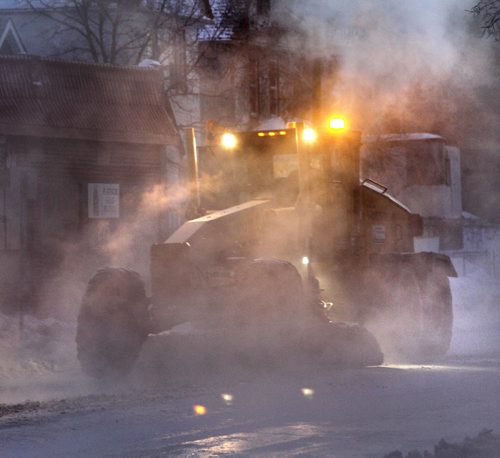 A grader and front end loaders clear out the ice on Selkirk Ave. between Main St. and Charles St. after a large water main break that occurred aprox. 1A.M. Thursday morning. Wayne Glowacki / Winnipeg Free Press Feb. 27   2014