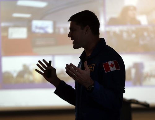 Stdup -One of CanadaÄôs newest astronauts will share the inspirational story of his path from farm boy to future rocket man, in a presentation to a group of science and technology students at Sisler High School on Thursday, February 27.Jeremy Hansen, 38, is the former CF-18 fighter pilot the Canadian Space Agency chose in 2009 as one of two members of the third Canadian Astronaut selection. Hansen is preparing to follow in the footsteps of fellow Canadian astronauts such as Chris Hadfield, the recently retired International Space Station Commander who captivated the world last year with his social media photos and reports from space. Sisler High School will also be making the presentation available to Grade 7 to 12 students in northern Manitoba through a live video link (see video screen in background ) to participating schools in the Frontier School Division, including West Lynn Heights School in Lynn Lake. Students from  Andrew Mynarski V.C. Junior High School, Prairie Rose School and Isaac Newton School in the Winnipeg School Division will also view the presentation via the live video link. FEB. 27 2014 / KEN GIGLIOTTI / WINNIPEG FREE PRESS