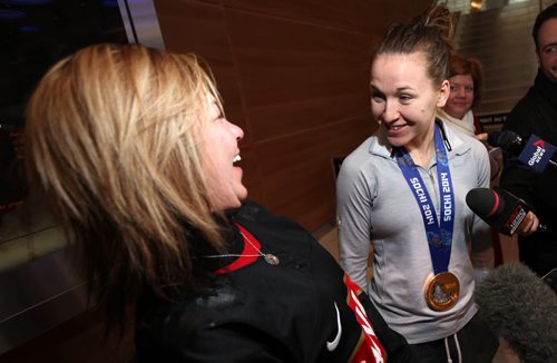 Jocelyne Larocque, arriving at the James Richardson International Airport, and her mom Nancy (left) share a laugh in Winnipeg Thursday afternoon. See Mary Agnes Welch story re: Olympic Gold. February 27, 2014 - (Phil Hossack / Winnipeg Free Press)
