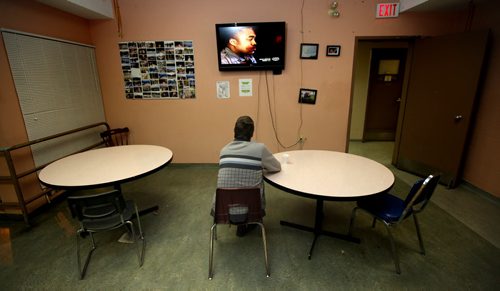 A client at Mainstay, a recovery shelter watches TV in the residence's common room Thursday evening. See Randy Turner's tale re: Homelessness.  January 23, 2014 - (Phil Hossack / Winnipeg Free Press)