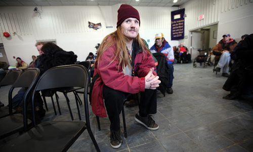 "Jonah" a resident at the Bell Hotel waits patiently for a prayer service to end at the Union Gosple Mission. A soup kitchen there serves lunch at the Mission, but participants have to take part in the service to get lunch. See Randy Turner's Homeless feature. February 20, 2014 - (Phil Hossack / Winnipeg Free Press)