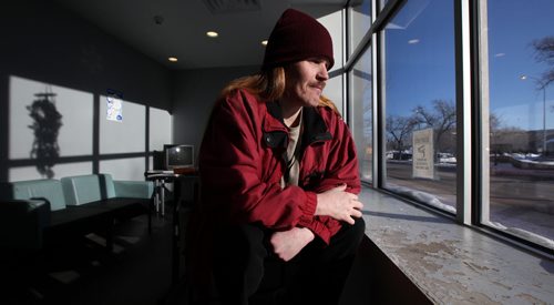 Sitting in the former hotel lobby, "Jonah" contemplates his daily morning walk to a methadone clinic in the frigid winter temperatures. He's a resident at the Bell Hotel where the Main Street Project works a "Harm Reduction" program.  See Randy Turner's Homeless feature. February 20, 2014 - (Phil Hossack / Winnipeg Free Press)